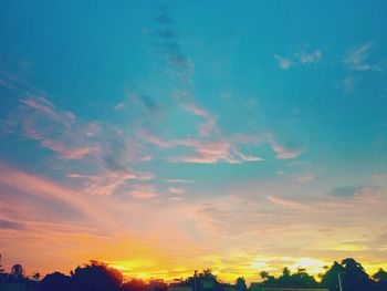 Low angle view of dramatic sky during sunset