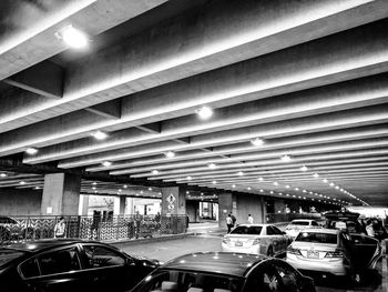 Cars in illuminated city at night