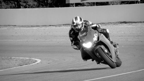 Man riding motorcycle on road