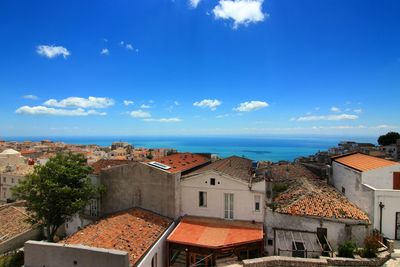 View of town against blue sky