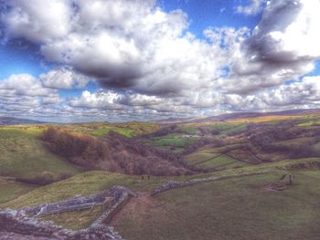 Scenic view of landscape against cloudy sky