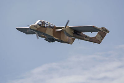 Low angle view of airplane against sky