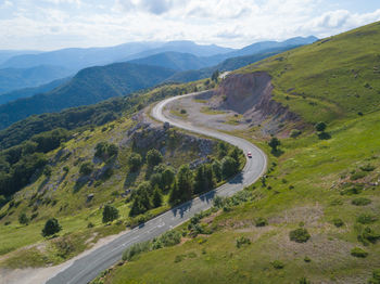 High angle view of road amidst mountains against sky