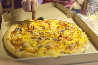 Close-up of hand holding ice cream