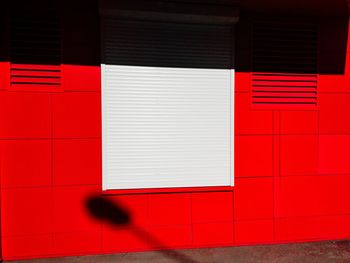 Red closed door of building