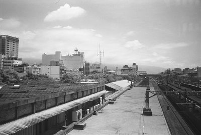 High angle view of railroad tracks amidst buildings in city