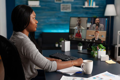 Businesswoman talking on video conference in office