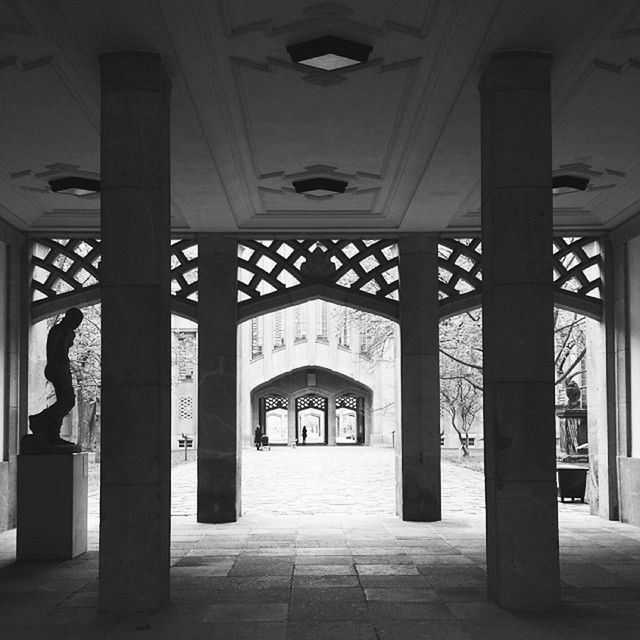 indoors, architecture, built structure, corridor, architectural column, ceiling, column, flooring, arch, lighting equipment, tiled floor, the way forward, empty, illuminated, door, building, sunlight, colonnade, interior, pillar