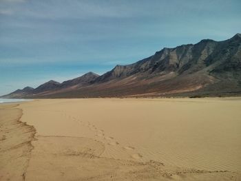 Scenic view of desert against sky