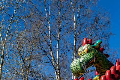 Low angle view of statue against blue sky