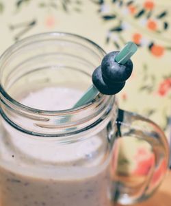 Close-up of drink in glass jar on table