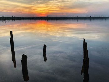 Scenic view of lake against sky during sunset