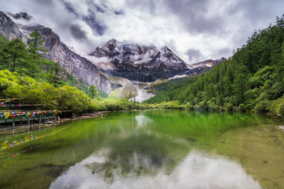 Scenic view of lake and mountains against sky