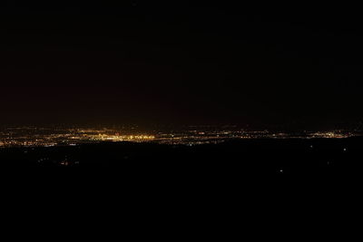 Illuminated cityscape at night