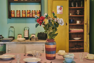 Flower vase on table at home
