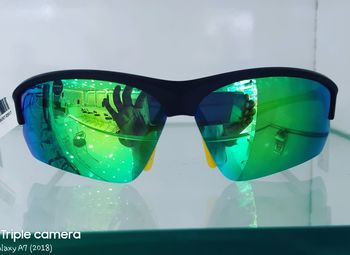 Close-up of sunglasses on glass