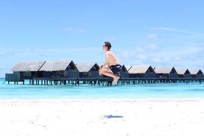 Full length of woman standing on beach