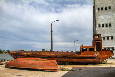 Abandoned construction site in city against sky