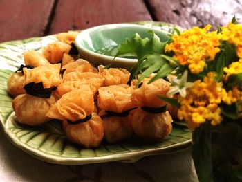 High angle view of vegetables in plate on table