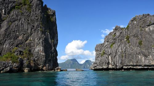 Panoramic view of sea and rocks against sky