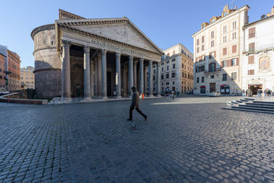 Man walking on street in city