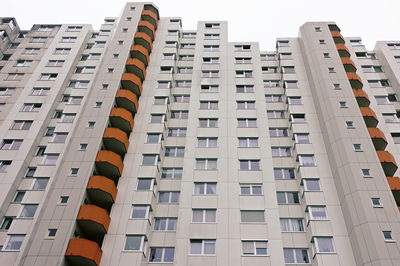 Low angle view of modern buildings in city against sky