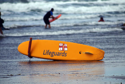 View of a surfboard on beach