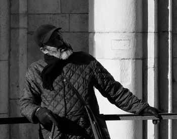 Midsection of man with umbrella