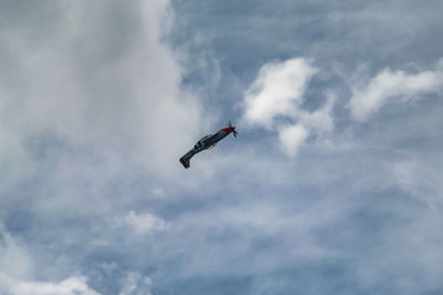 Low angle view of airplane flying in sky