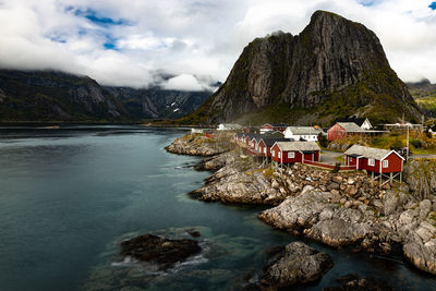 Scenic view of sea and mountains against sky