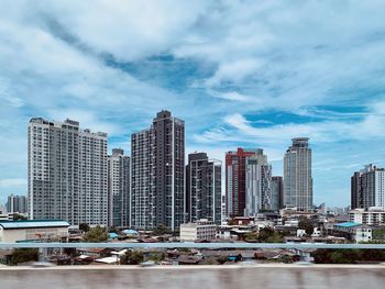 Modern buildings in city against sky