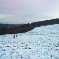 Scenic view of snow covered mountain against sky