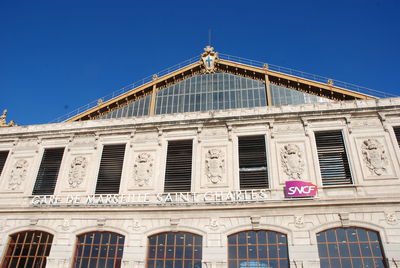 Low angle view of building against blue sky