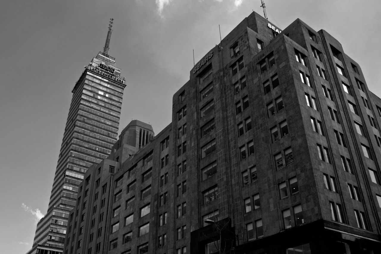 architecture, building exterior, built structure, low angle view, city, sky, tall - high, tower, skyscraper, modern, building, office building, tall, window, day, cloud - sky, outdoors, no people, glass - material, cloud