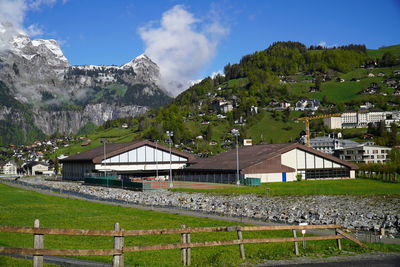 Houses in city against sky