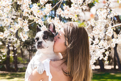 Portrait of young woman with dog