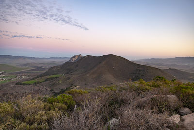 Scenic view of landscape against sky during sunset