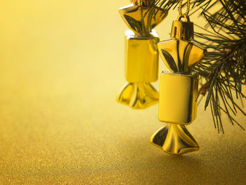 Close-up of christmas ornaments hanging on tree