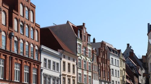 Low angle view of buildings against clear sky