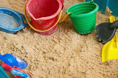 High angle view of toys on beach