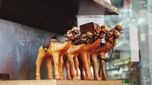Close-up of camel sculptures for sale in market