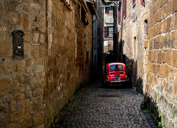 Narrow alley amidst buildings in city