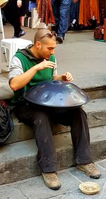 Boy sitting outdoors