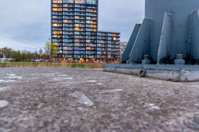 View of construction site by building against sky