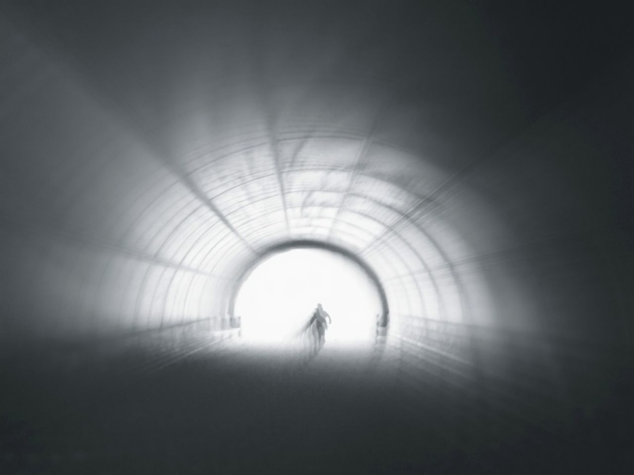 indoors, tunnel, walking, lifestyles, the way forward, full length, men, arch, leisure activity, rear view, ceiling, unrecognizable person, silhouette, diminishing perspective, person, built structure, light at the end of the tunnel, illuminated