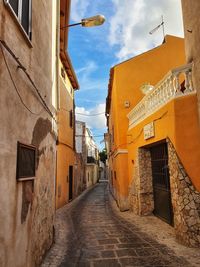 Narrow alley amidst buildings in city