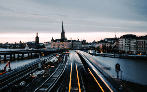 High angle view of railroad tracks amidst buildings in city