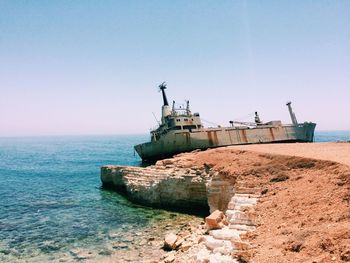 Ship in sea against clear sky