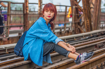 Portrait of woman sitting outdoors