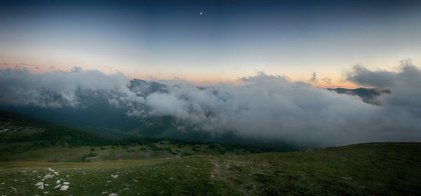 Scenic view of landscape against dramatic sky